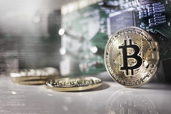 Bitcoin coin close-up representing a BTC to USDT conversion