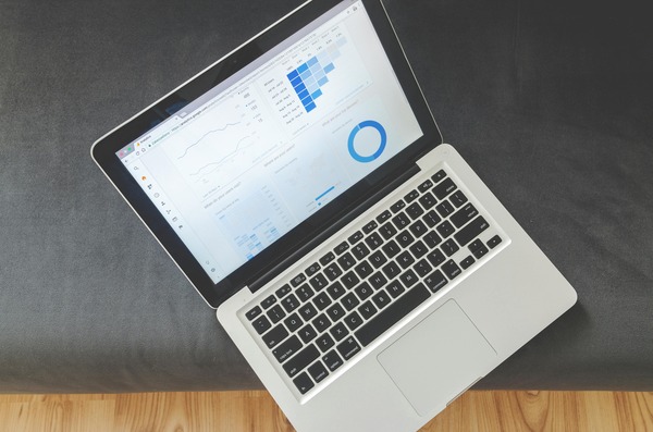Person reviewing cryptocurrency rate data on a laptop